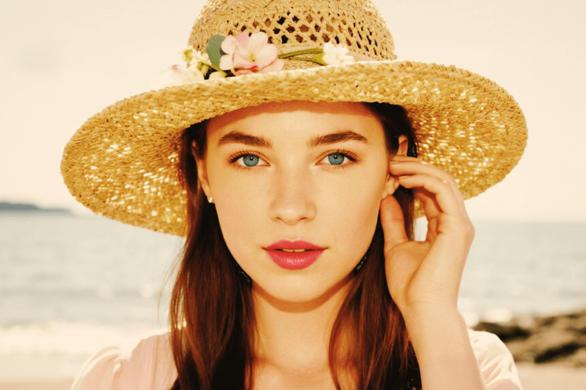 Vintage version of a girl with a staw hat